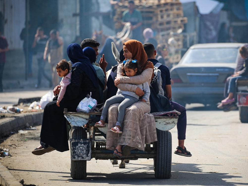 Displaced Palestinians travel on a cart in Rafah, southern Gaza Strip, on May 7.