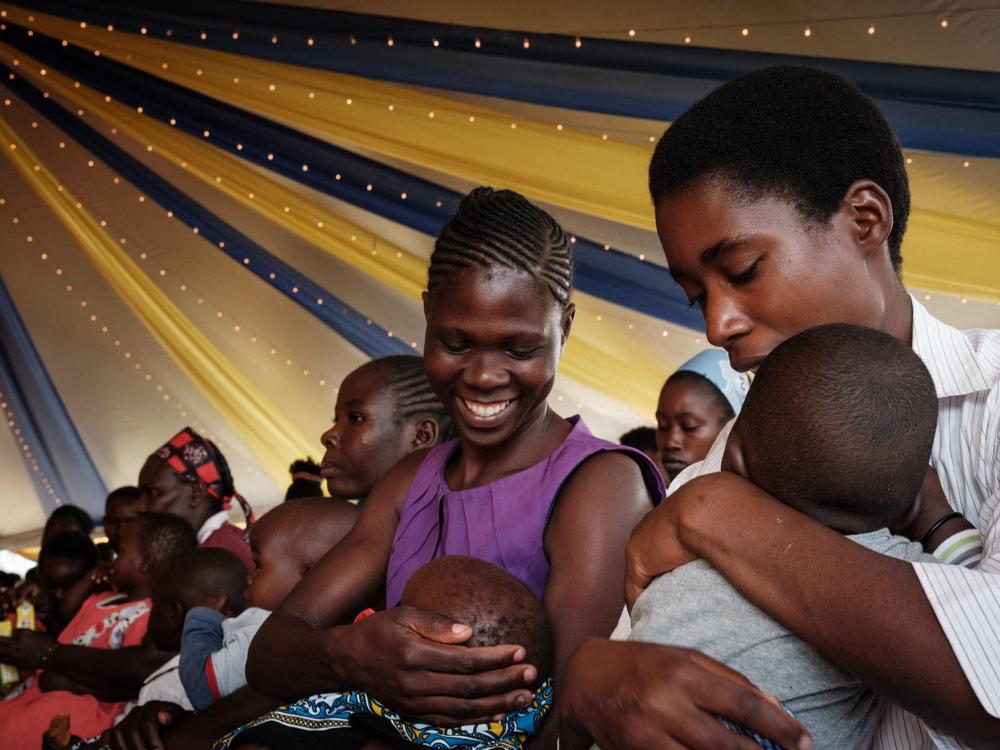 Mothers participate in a pilot program for one of two new malaria vaccines.