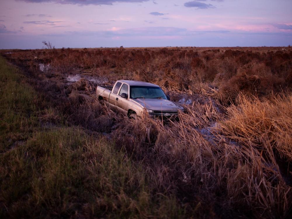  A truck sits in still water after Hurricane Laura swept through Cameron Parish, La., in 2020. The storm killed dozens of people in the U.S.
