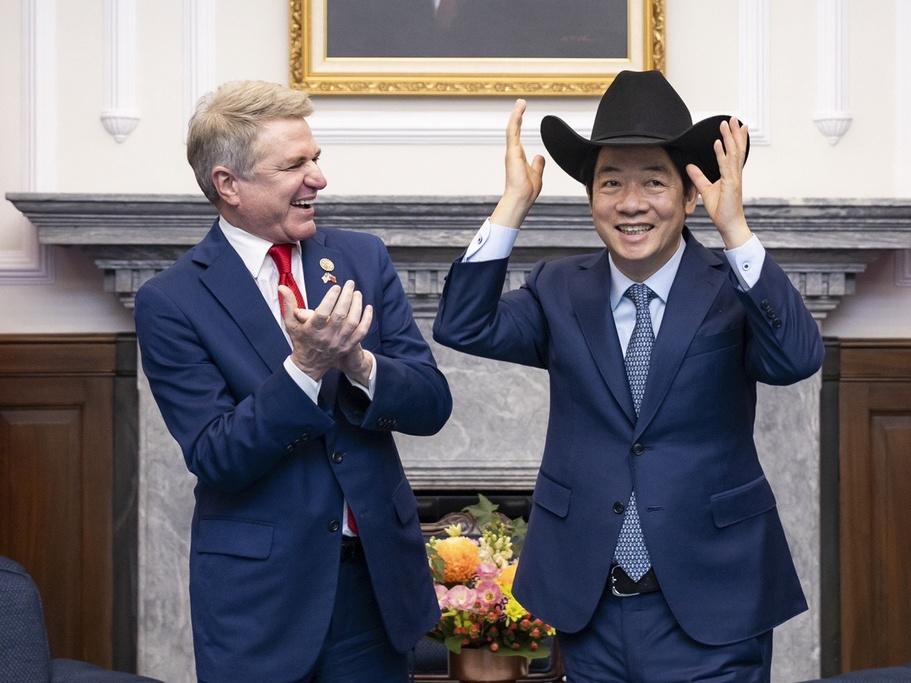In this photo released by the Taiwan Presidential Office, Taiwan President Lai Ching-te, right, puts on a cowboy hat given by Rep. Michael McCaul, R-Texas, during a Monday meeting in Taipei, Taiwan. A U.S. congressional delegation met Taiwan's new leader on Monday in a show of support shortly after China held drills around the self-governing island in response to his inauguration speech. 