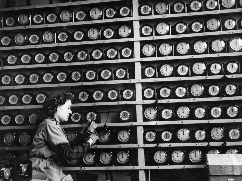 The timesinks, they are a changin’.<strong> </strong>Above, a woman checks alarm clocks in a London clock factory in 1946.