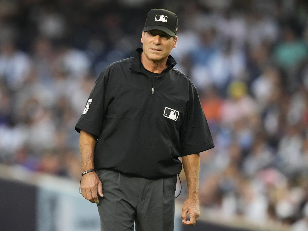 Umpire Ángel Hernández looks on during the first inning of a baseball game between the New York Yankees and the Houston Astros, Aug. 4, 2023, in New York.