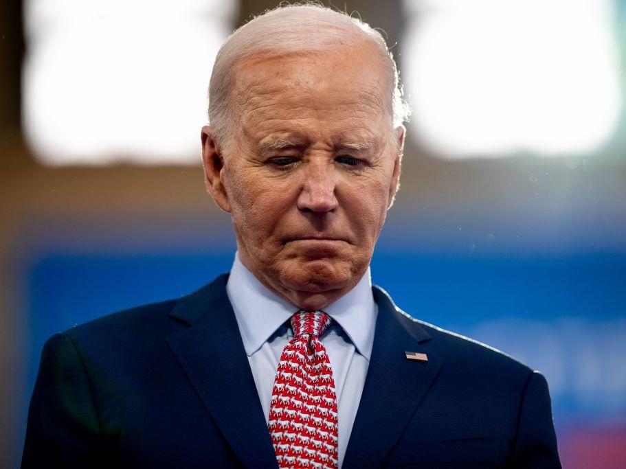 President Biden stands on stage as Vice President Kamala Harris introduces him during a campaign rally Wednesday at Girard College in Philadelphia.