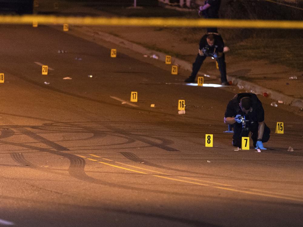 This image, courtesy of News 5 Cleveland, shows officers of the Akron Police Department investigating a shooting that happened overnight in Akron, Ohio, on Sunday.