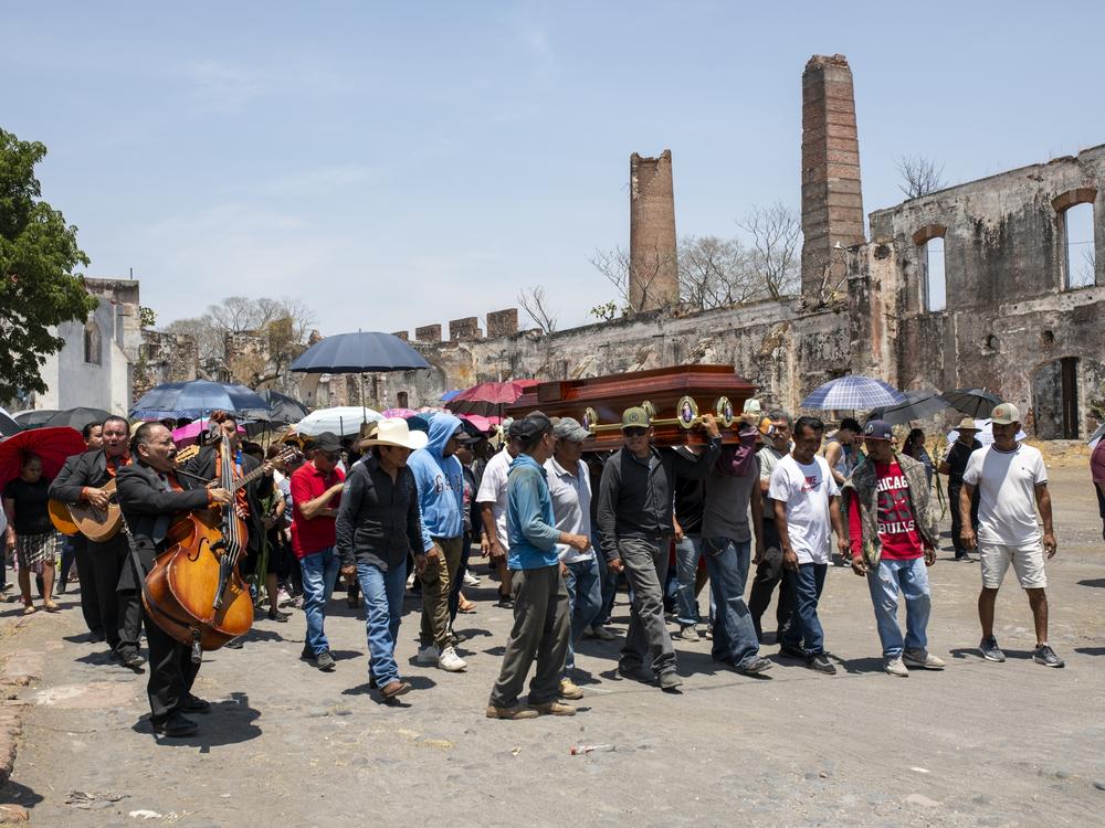 A group of family and friends carry the coffin of Jorge Huerta Cabrera, 31, who was a candidate for councilor for the Green Party, and was murdered on May 31, two days before the vote. on San Nicolas Tolentino, Mexico, June 2, 2024.