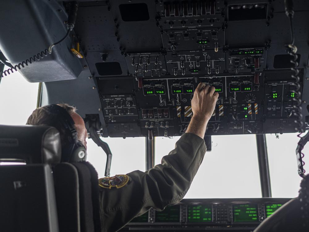 Major Will Simmons co-pilots a Hurricane Hunter weather training flight a week before the start of an Atlantic Hurricane season forecasters predict will be 