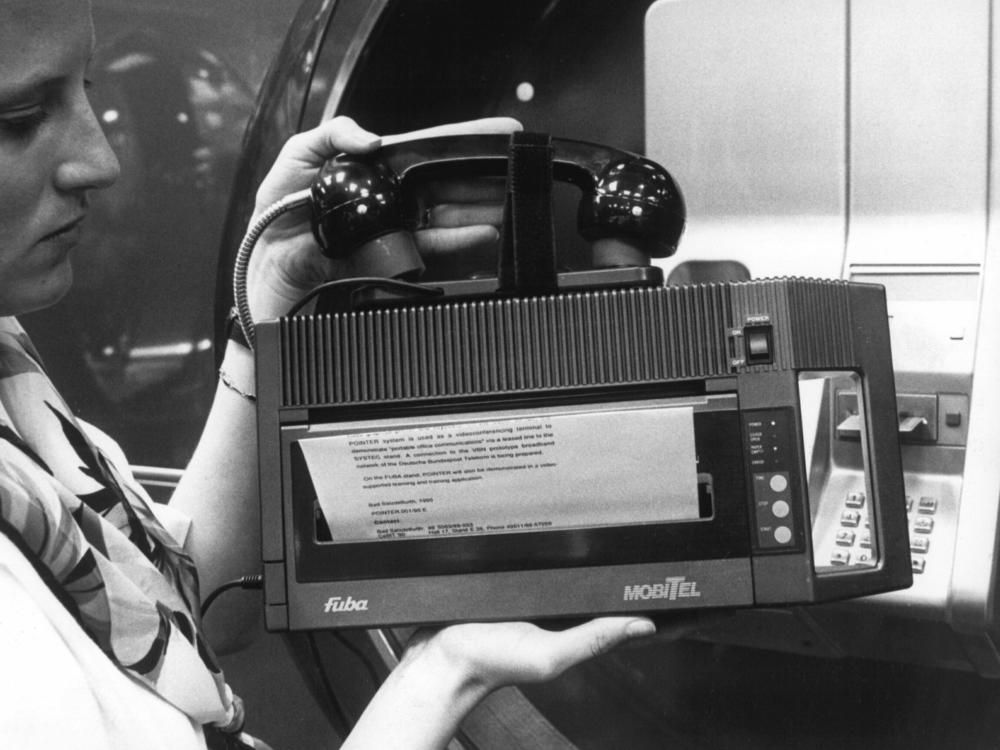 The CeBit technology fair in Hanover, Germany, March 24, 1990, shows a portable fax machine that weighs 3 kilos (6.6 pounds) and can be connected to any telephone via acoustic couplers.