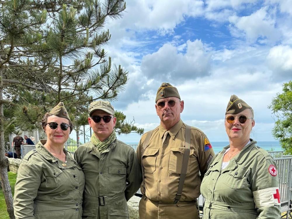  Jacquy Patrice with his with Dorothé and some friends, dressed as World War II-era U.S. soldiers, a Women’s Army Corps member and a nurse.