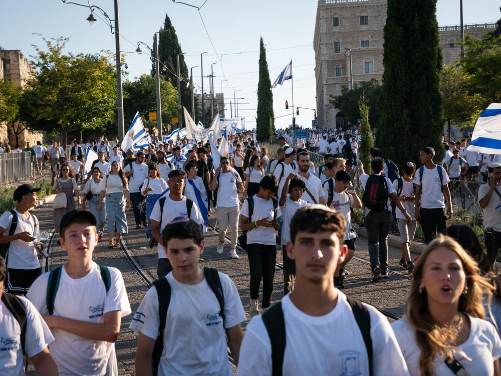 Tens of thousands of Israelis marched through the streets of Jerusalem Wednesday to mark Jerusalem Day. The march begins in west Jerusalem and travels through east Jerusalem and the Muslim Quarter of the Old City, ending at the Western Wall. The march marks the anniversary of the Six-Day War in 1967, when Israel annexed east Jerusalem, including the Western Wall.
