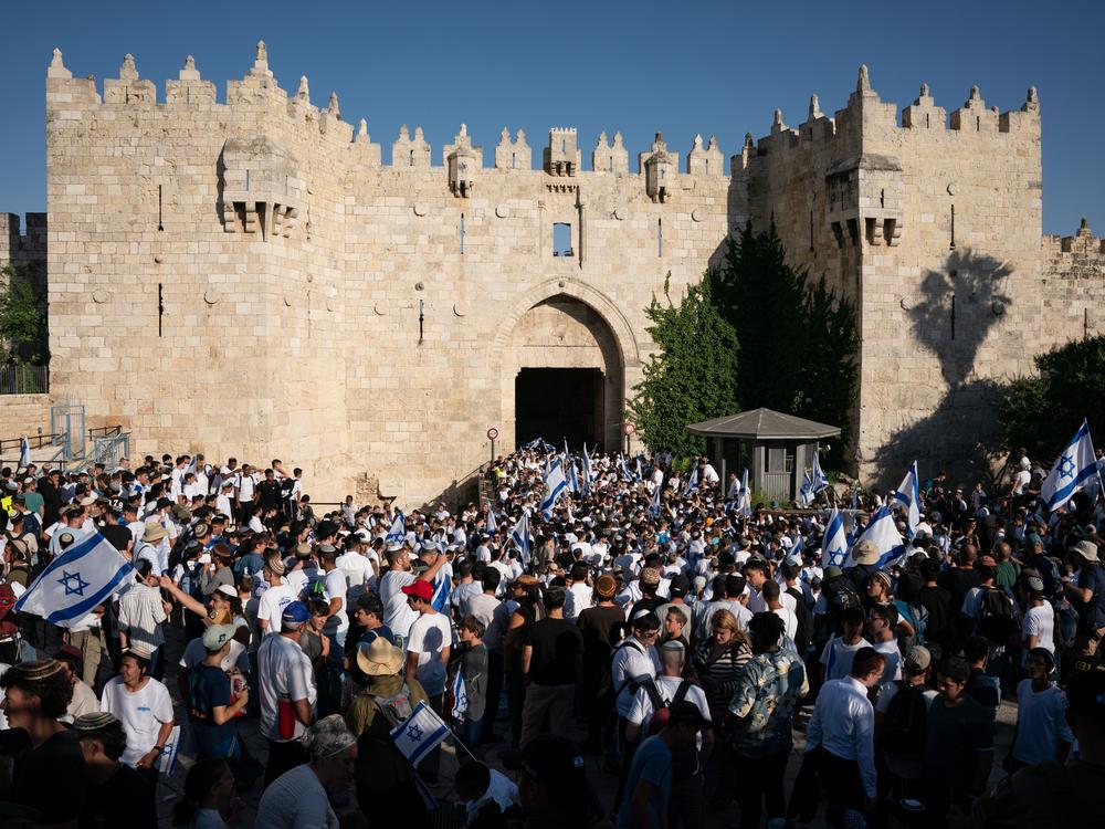 Israeli marchers dance at Damascus Gate, the entrance to the Muslim Quarter of the Old City. Tens of thousands of Israelis marched through the streets of Jerusalem Wednesday for Jerusalem Day. 