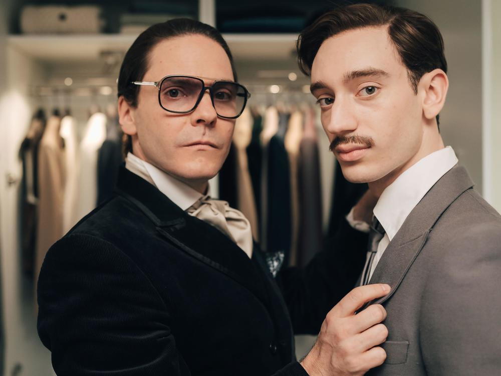 Fashion designer Karl Lagerfeld (Daniel Brühl), left, meets and falls in love with Jacques de Bascher (Théodore Pellerin) in <em>Becoming Karl Lagerfeld</em>.