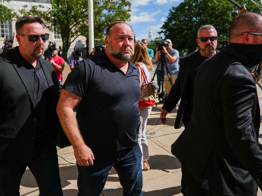 Infowars founder Alex Jones speaks to the media outside Waterbury Superior Court during his trial in September 2022 in Waterbury, Conn.
