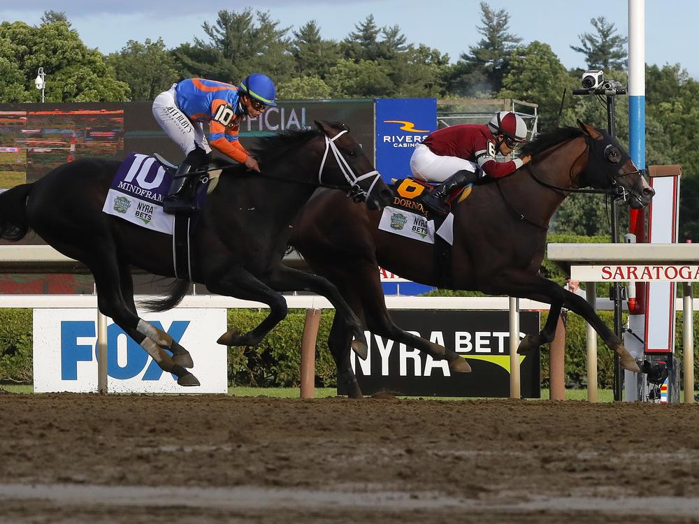 Dornoch, (6), with Luis Saez up, crosses the finish line ahead of Mindframe (10), with Irad Ortiz Jr. up, to win the 156th running of the Belmont Stakes horse race on Saturday in Saratoga Springs, N.Y.