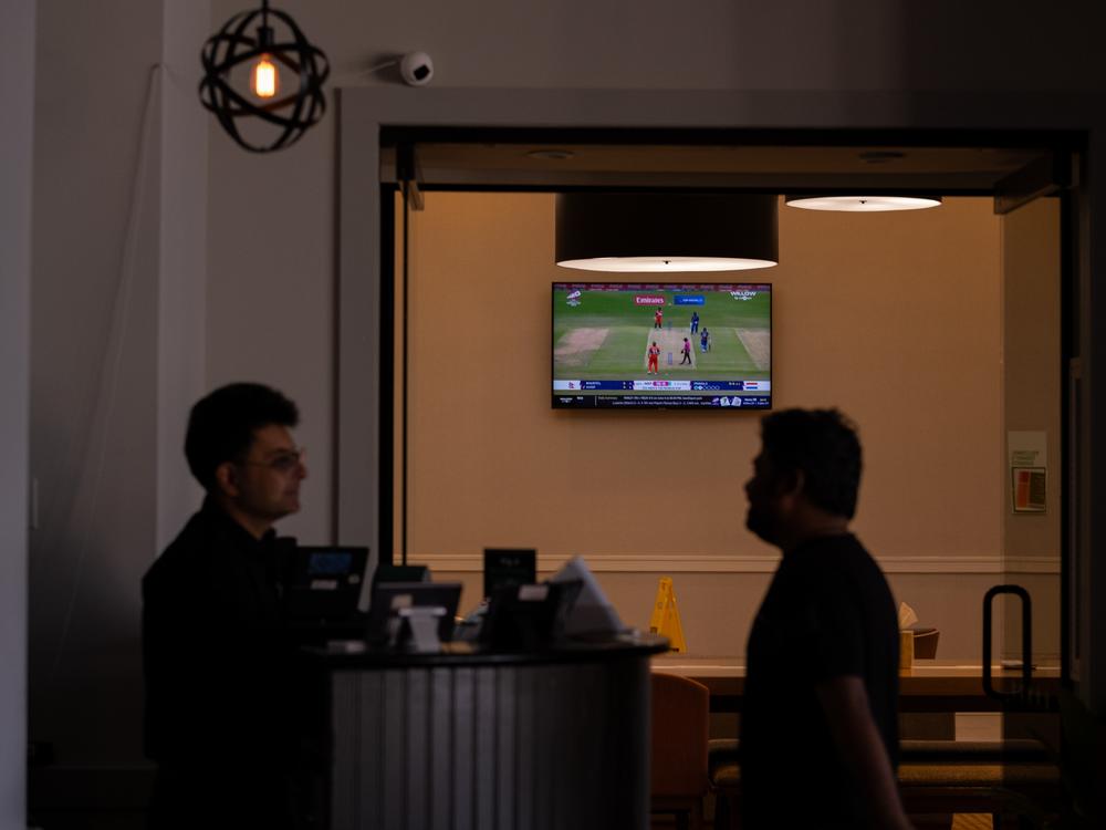 Cricket plays on the TV in the lobby of the Holiday Inn hotel that's connected to the Royale Restaurant & Bar, on June 4.