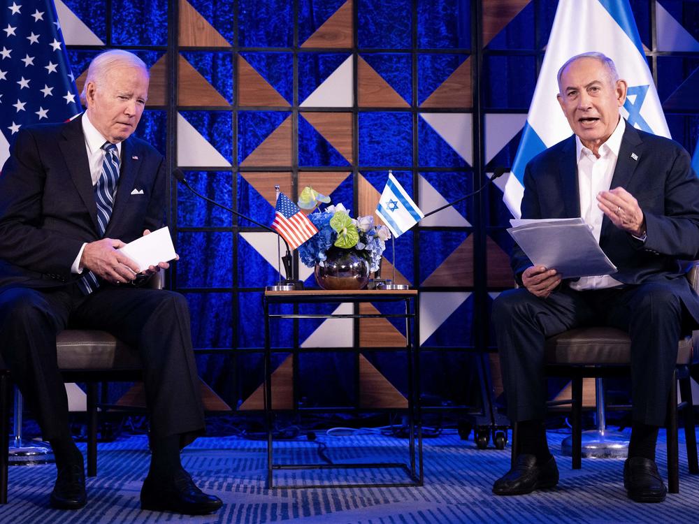 President Biden listens to Israel's Prime Minister Benjamin Netanyahu in Tel Aviv on Oct. 18, 2023, just days after the start of the Israel-Hamas war in Gaza. Biden and Netanyahu have long had a difficult relationship, further strained by the current war. Biden supports Israel's war aims, but says it must do more to prevent Palestinian civilian casualties and to allow humanitarian aid into Gaza. 