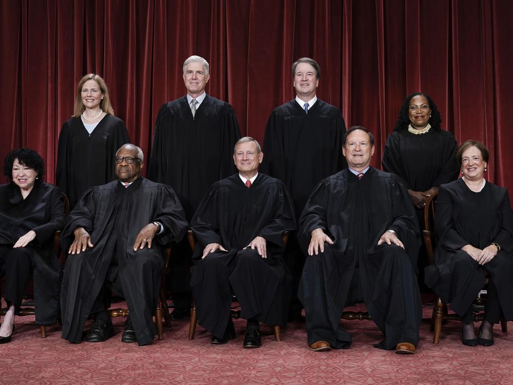 Members of the Supreme Court sit for a new group portrait following the addition of Associate Justice Ketanji Brown Jackson, at the Supreme Court building in Washington, D.C., on Oct. 7, 2022.