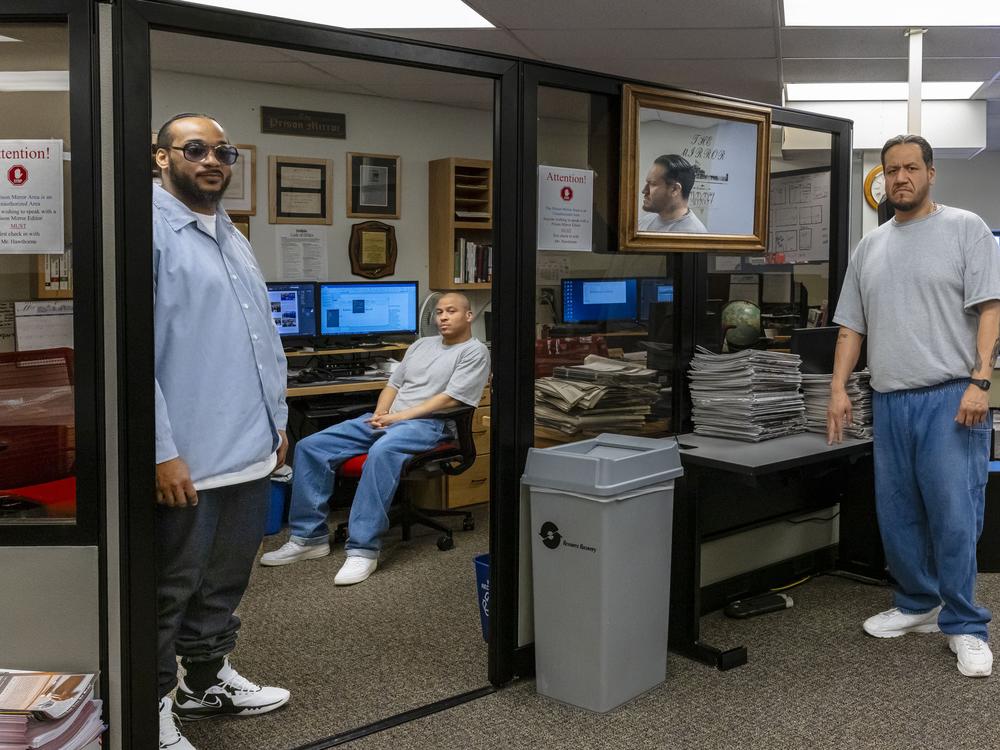 Richard Adams, left, Paul Gordon, center; and Patrick Bonga make up the staff of the <em>Prison Mirror</em> at the Minnesota Correctional Facility - Stillwater. The men say they're limited in what they can write about, but they still find meaning in the work.