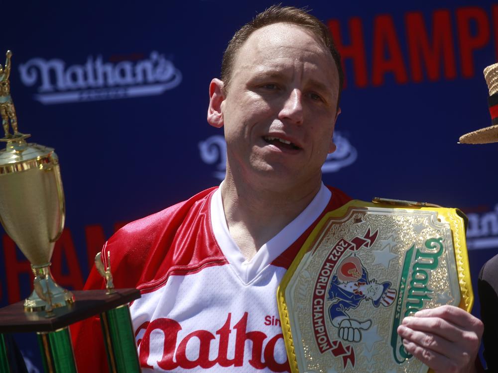 Joey Chestnut emerges victorious after eating 63 hot dogs in 10 minutes during the 2022 Nathans Famous Fourth of July International Hot Dog Eating Contest in New York City.