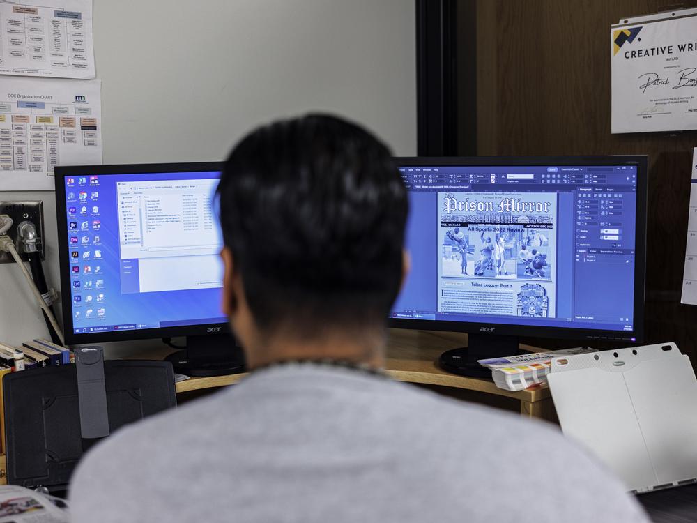 Patrick Bonga, a senior editor, works on the layout for the latest issue of the <em>Prison Mirror</em> at the Stillwater prison.