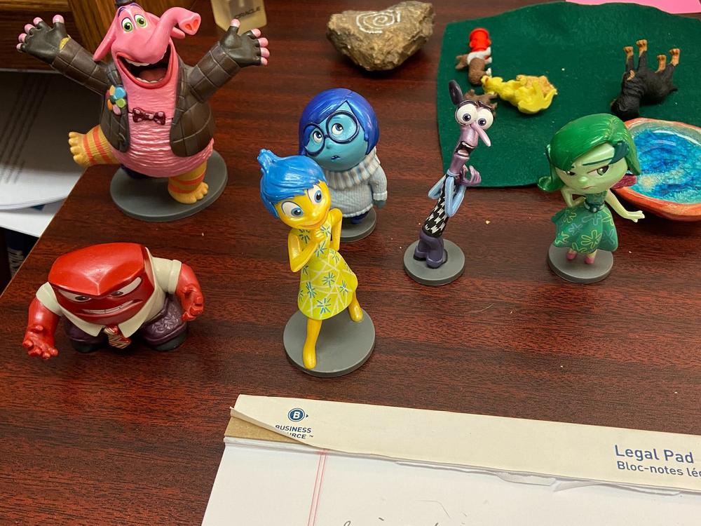 <em>Inside Out </em>emotion figurines on Kristi Zybulewski's desk.