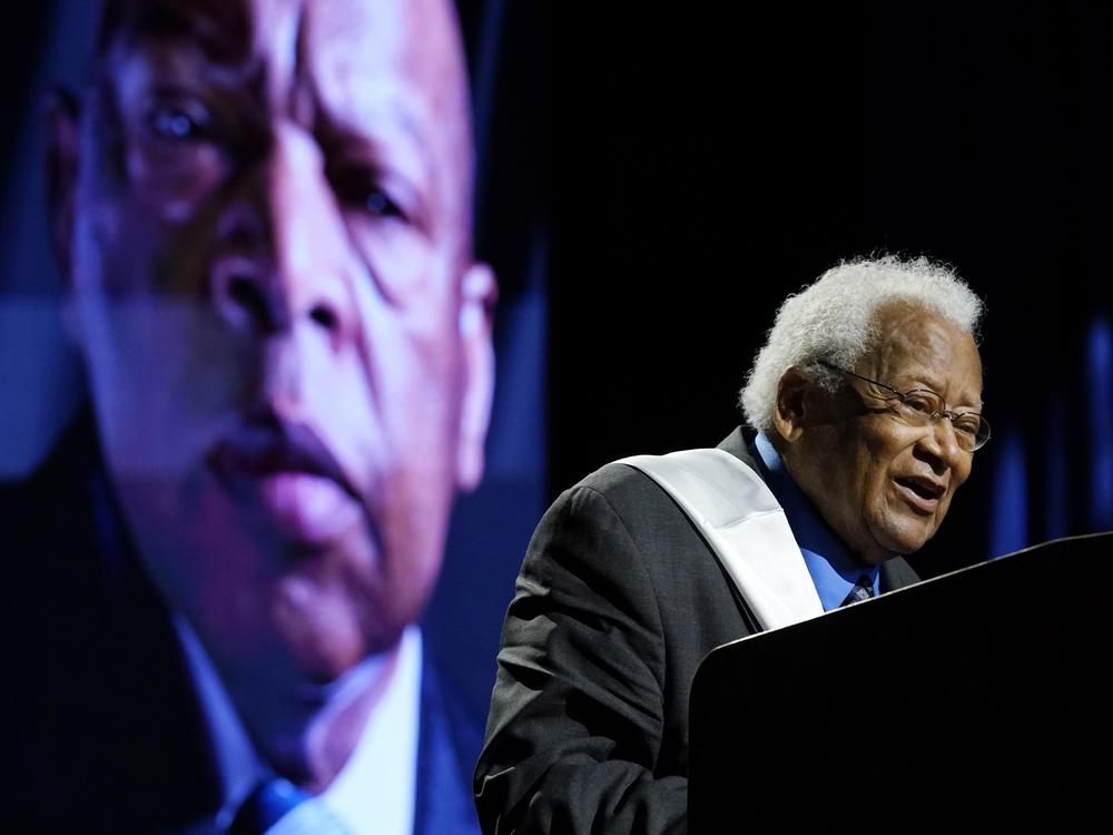 The Rev. James Lawson speaks speaks during a celebration of life marking the one-year anniversary of U.S Rep. John Lewis's death July 17, 2021 in Nashville, Tenn. A portrait of Rep. Lewis is shown in the background.