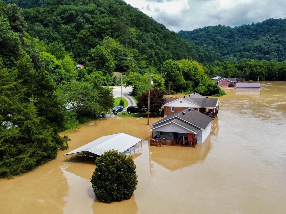 Catastrophic flash floods killed dozens of people in eastern Kentucky in July 2022. Here, homes in Jackson, Ky., are flooded with water.