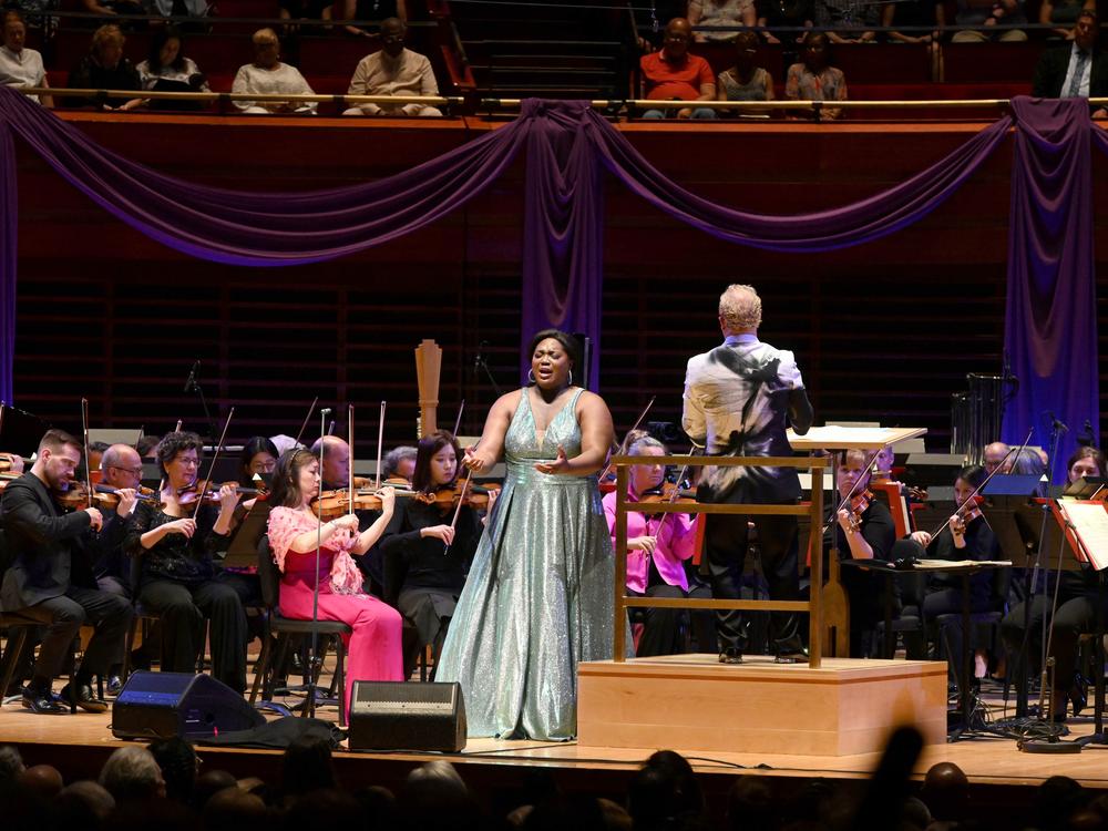 Soprano Angel Blue (center) performs with conductor Yannick Nézet-Séguin and the Philadelphia Orchestra during a concert celebrating the renaming of the orchestra's main performance space as Marian Anderson Hall.