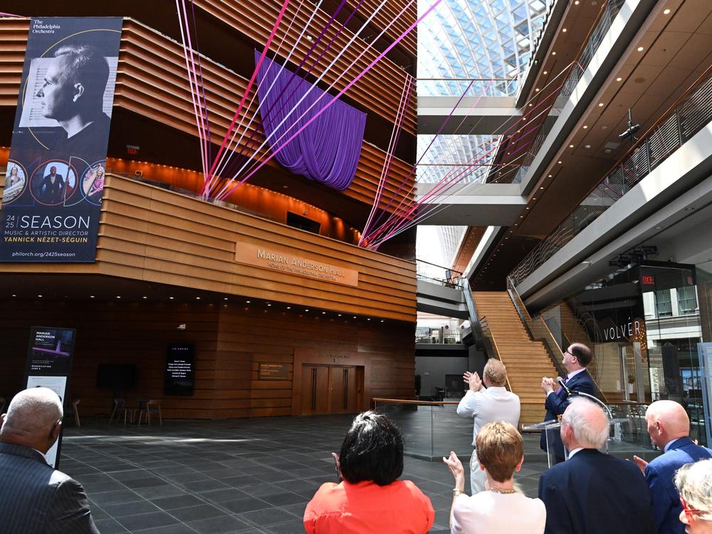 Spectators applaud the unveiling of the newly named Marian Anderson Hall in Philadelphia, Pa.