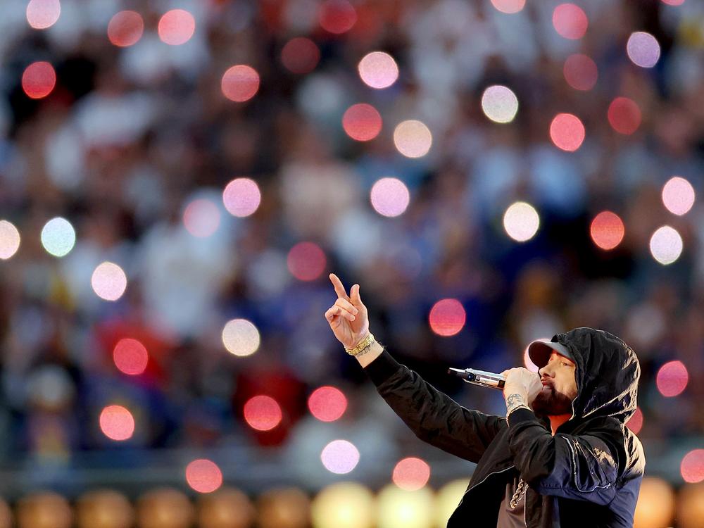 Eminem, performing here during the Super Bowl LVI Halftime Show at SoFi Stadium in 2022, returns to the top 10 of the <em>Billboard</em> Hot 100 chart this week with 