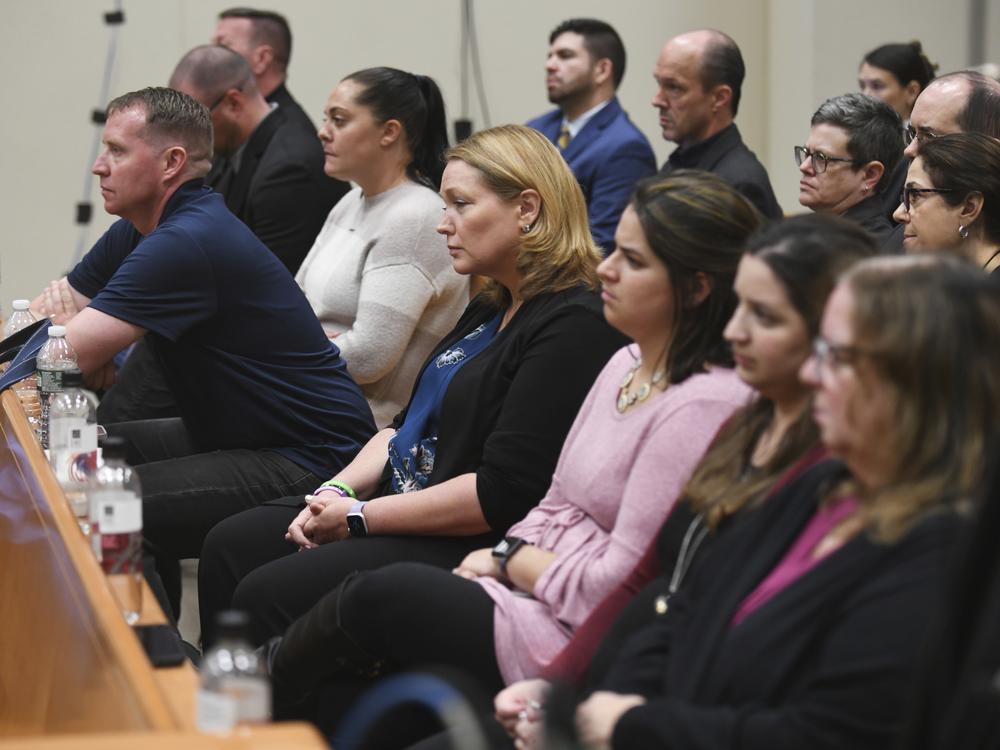 Families of Sandy Hook victims sit in the front row as Infowars founder Alex Jones testifies during the Sandy Hook defamation damages trial in Waterbury, Conn., in 2022. 