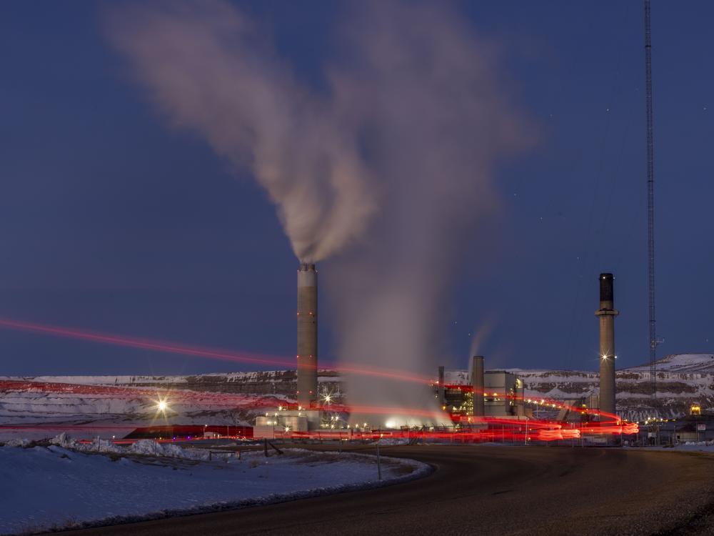 Taillights trace the path of a motor vehicle at the Naughton Power Plant, Jan. 13, 2022, in Kemmerer, Wyo. Bill Gates and his energy company are starting construction at their Wyoming site adjacent to the coal plant for a next-generation nuclear power plant he believes will “revolutionize” how power is generated.