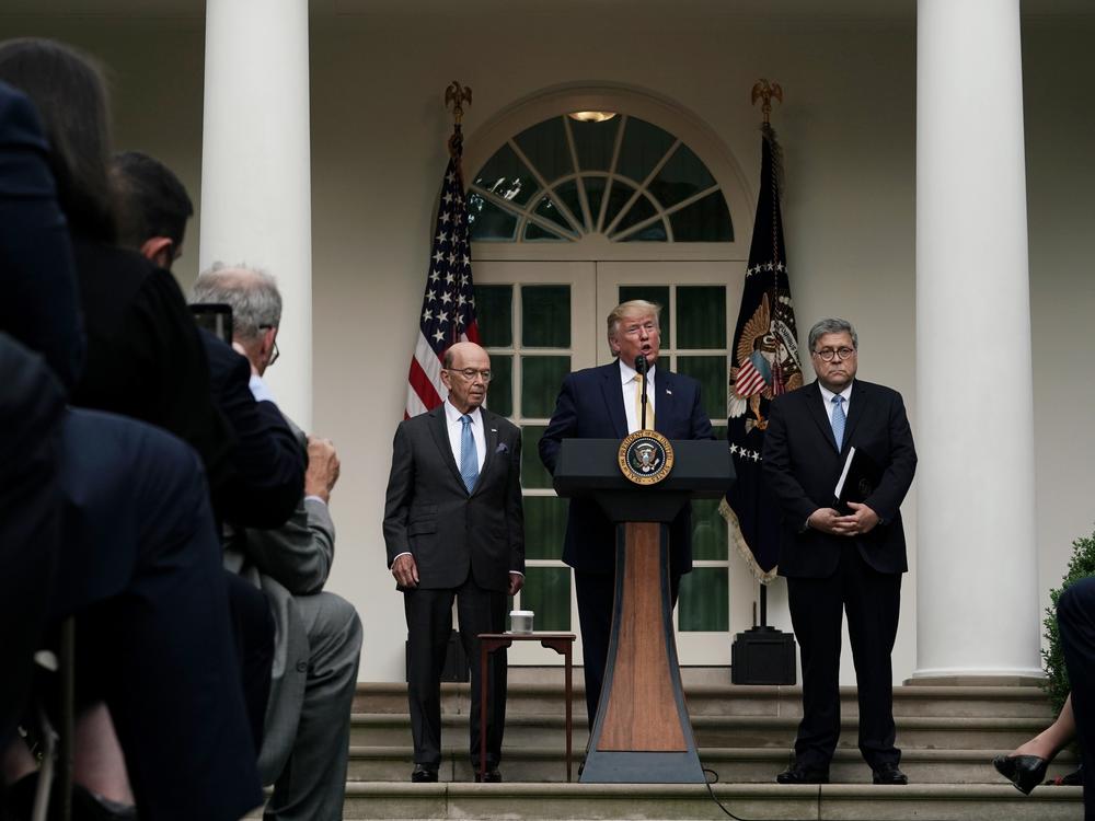 President Donald Trump makes a statement on the census with Secretary of Commerce Wilbur Ross (L) and Attorney General William Barr in the Rose Garden of the White House on July 11, 2019 in Washington, D.C. 