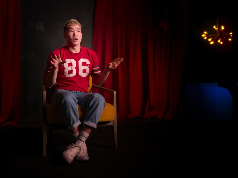 Joel Kim Booster in <em>Outstanding: A Comedy Revolution.</em>