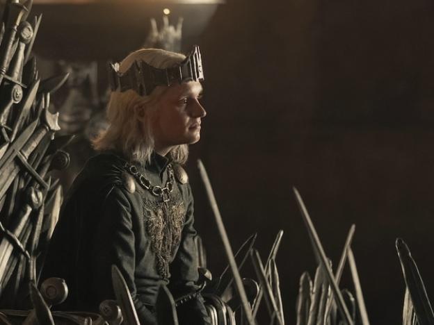 Aegon II (Tom Glynn-Carney) on the famously pointy and rusty Iron Throne.