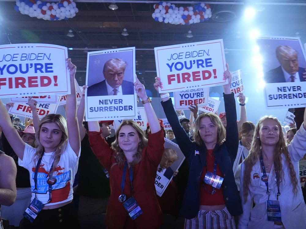 People arrive before Republican presidential candidate former President Donald Trump speaks at the 