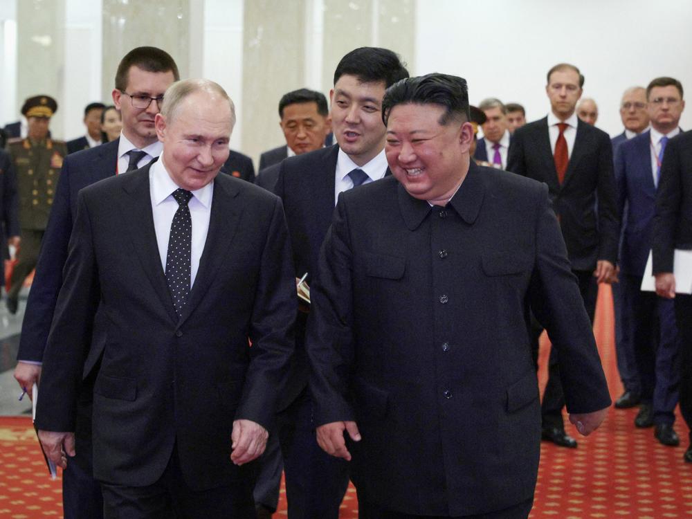 In this pool photograph distributed by the Russian state agency Sputnik, Russian President Vladimir Putin (left) and North Korea's leader Kim Jong Un attend a gala concert in Pyongyang, on Wednesday.