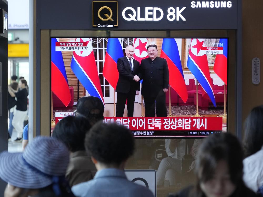 A TV screen shows an image of North Korean leader Kim Jong Un and Russian President Vladimir Putin during a news program, at the Seoul Railway Station in South Korea, Wednesday. Kim promised full support for Russia's war in Ukraine before beginning a one-on-one meeting with Putin in Pyongyang, in a bid to expand their economic and military cooperation and show a united front against Washington.