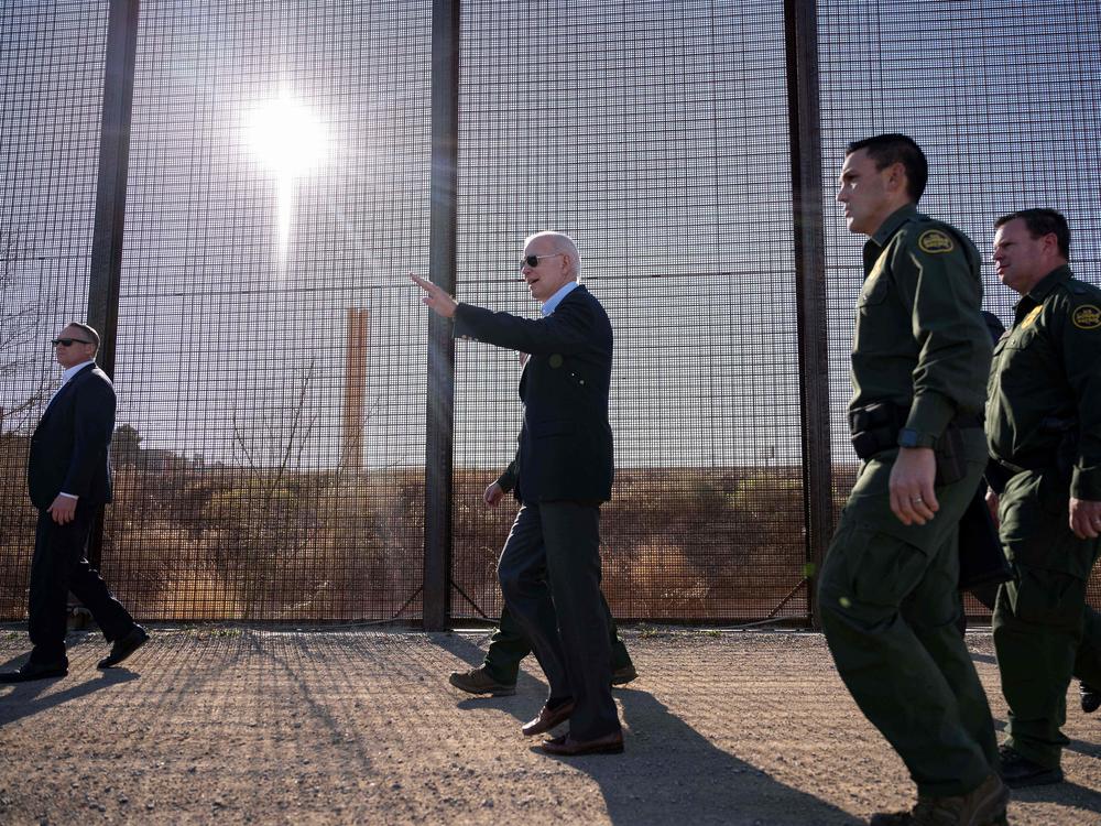 US President Joe Biden walks along the US-Mexico border fence in El Paso, Texas, on January 8, 2023.