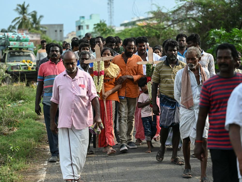 Family members take part in a funeral procession for victims who died after consuming toxic alcohol in Kallakurichi district of India's Tamil Nadu state on Thursday.