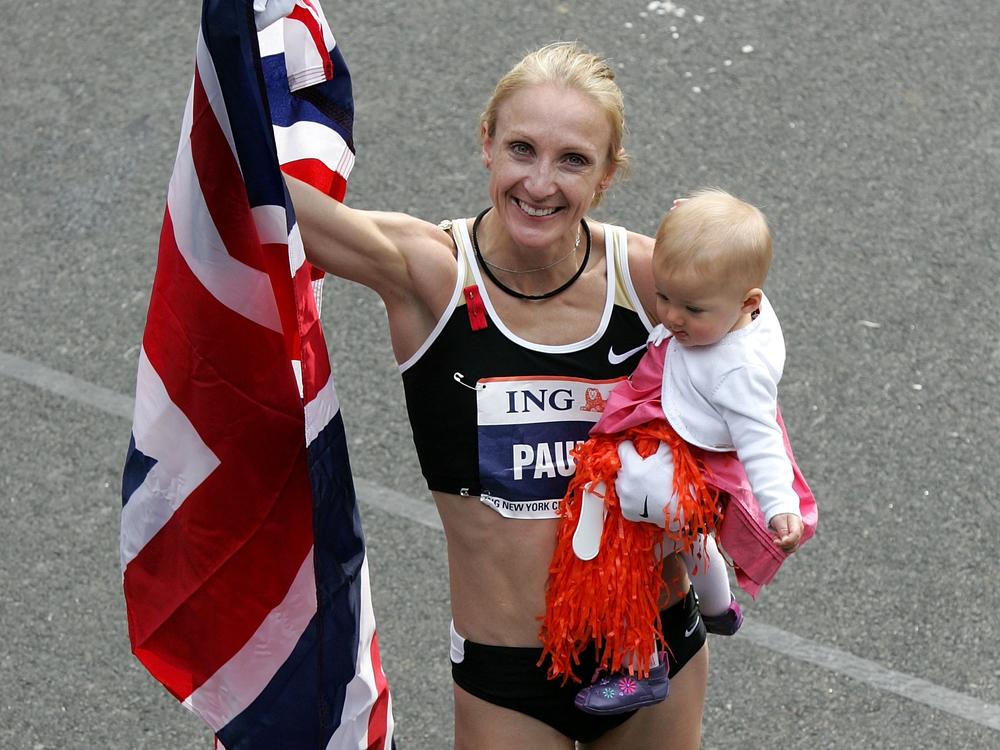 Paula Radcliffe celebrates with her daughter, Isla, after winning the women's division in the New York City Marathon on Nov. 4, 2007. 