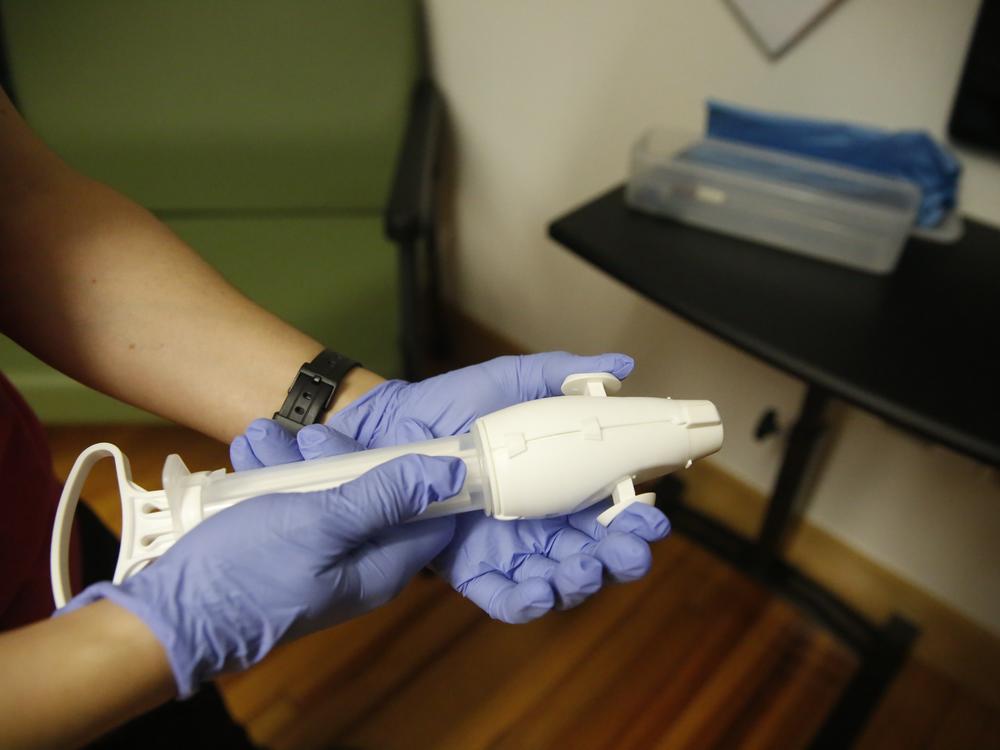 For the patients having procedural abortions Dr. Arnold uses what’s called a “SofTouch” device — a small, hand-held tool that creates a vacuum and allows a doctor to empty the uterus through suction.