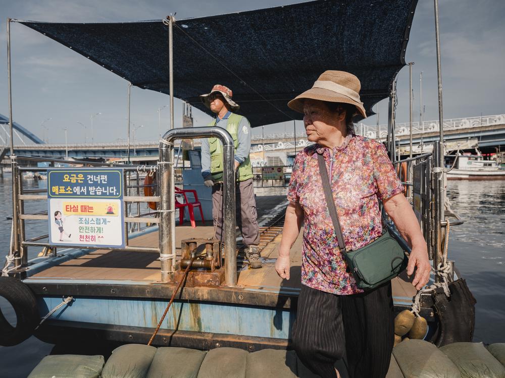 Kim Yong-jae, 82, gets off the Gaetbae ferry in Sokcho, South Korea, on Sept. 12, 2023.