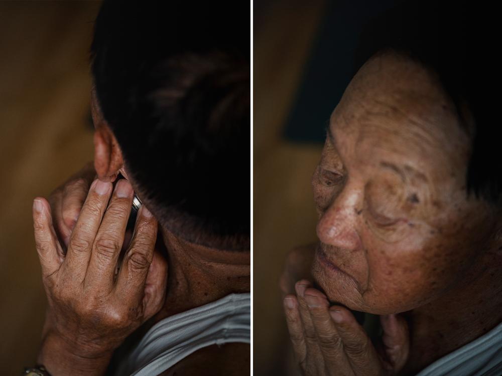 Kim Chul-hwan, 85, shaves while sitting in his room at his home in Abai Village on Sept. 10, 2023. Kim left North Korea when he was 13 and has been displaced for the past 70 years, living in the village since 1953.