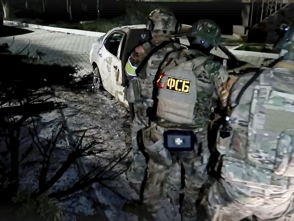 FSB officers conduct a counter-terrorist operation in the Republic of Dagestan, Russia, in this photo taken from video released by the National Antiterrorism Committee on Monday.  