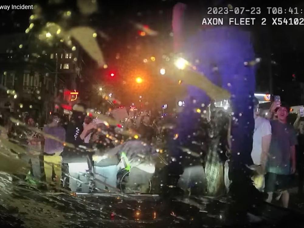  Seattle Police Department dashcam shows spectators at a 