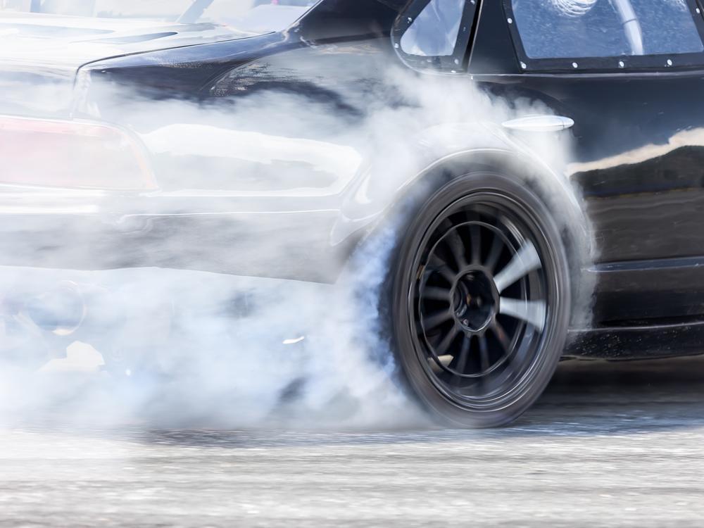 Illustration: Burning rubber at a race. At illegal 