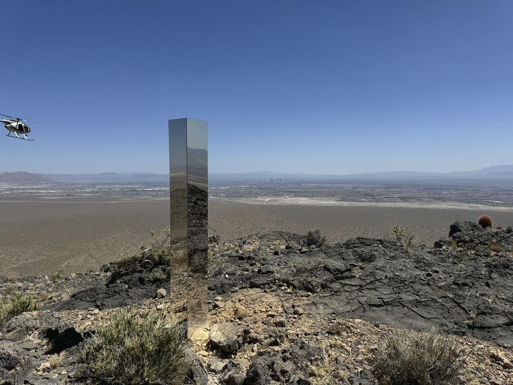 This photo provided by the Las Vegas Metropolitan Police Department shows the monolith found in Gass Peak in Nevada's Desert National Wildlife Refuge.
