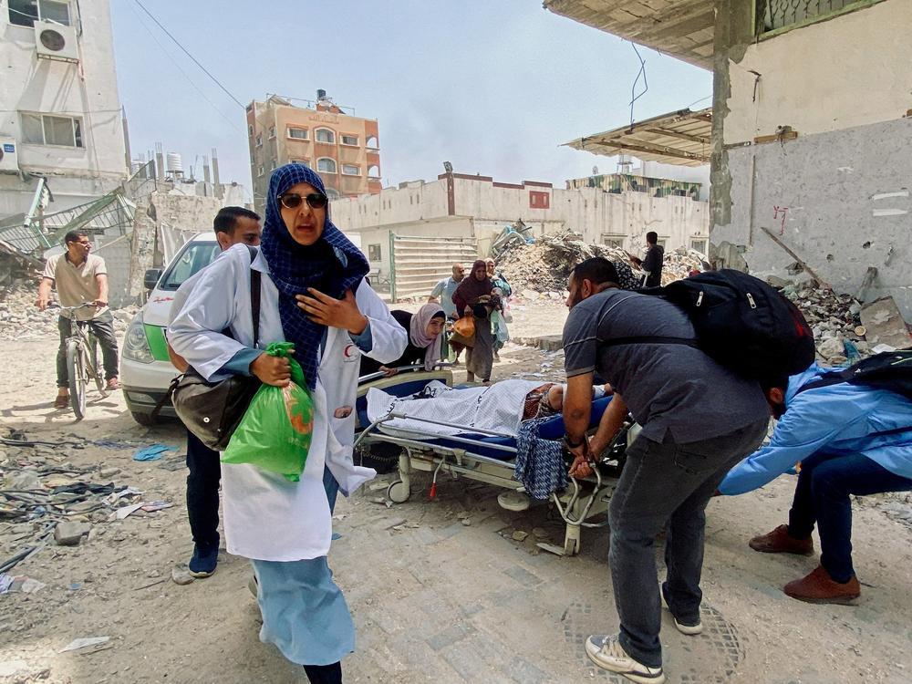 Palestinians evacuate Kamal Adwan hospital following an Israeli strike, amid the ongoing conflict between Israel and the Palestinian Islamist group Hamas, in Beit Lahia in the northern Gaza Strip, on May 21. 