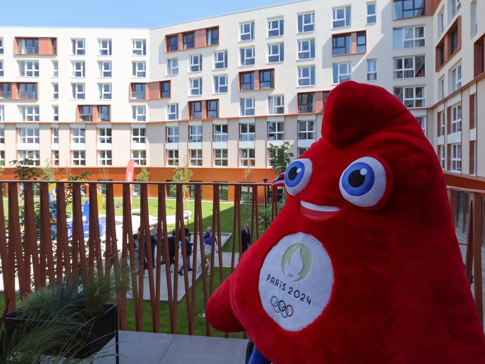 The Olympic mascot, called Phryge, stands on a balcony during the inauguration of the Olympic Village in Villeneuve d'Ascq near Lille in the north of France, where the basketball and handball teams will stay.