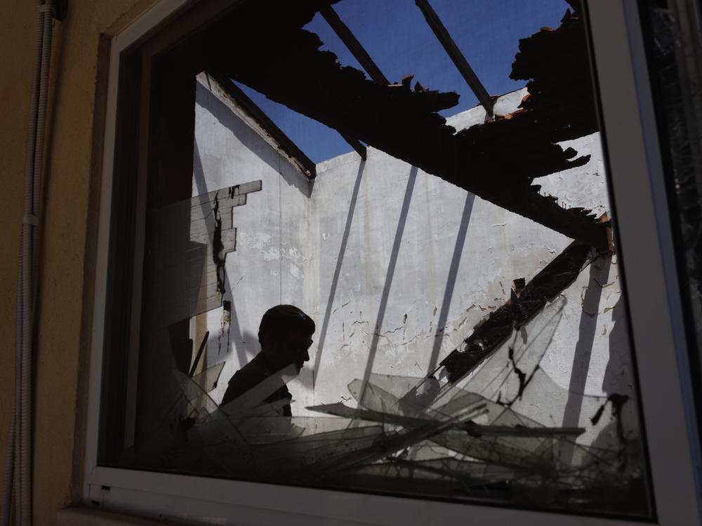 Near the border with Lebanon in June, an Israeli soldier is seen in a house damaged by a Hezbollah anti-tank missile. Hezbollah uses low-flying anti-tank missiles and small drones to evade Iron Dome's interceptors.